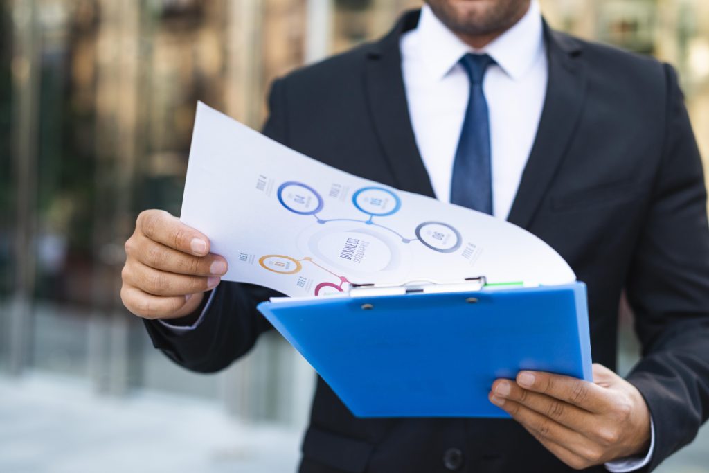 front-view-business-man-looking-charts